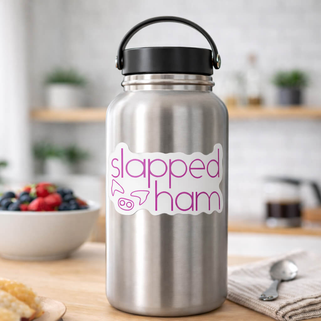 Stainless steel water bottle with 'slapped ham' sticker on a kitchen counter