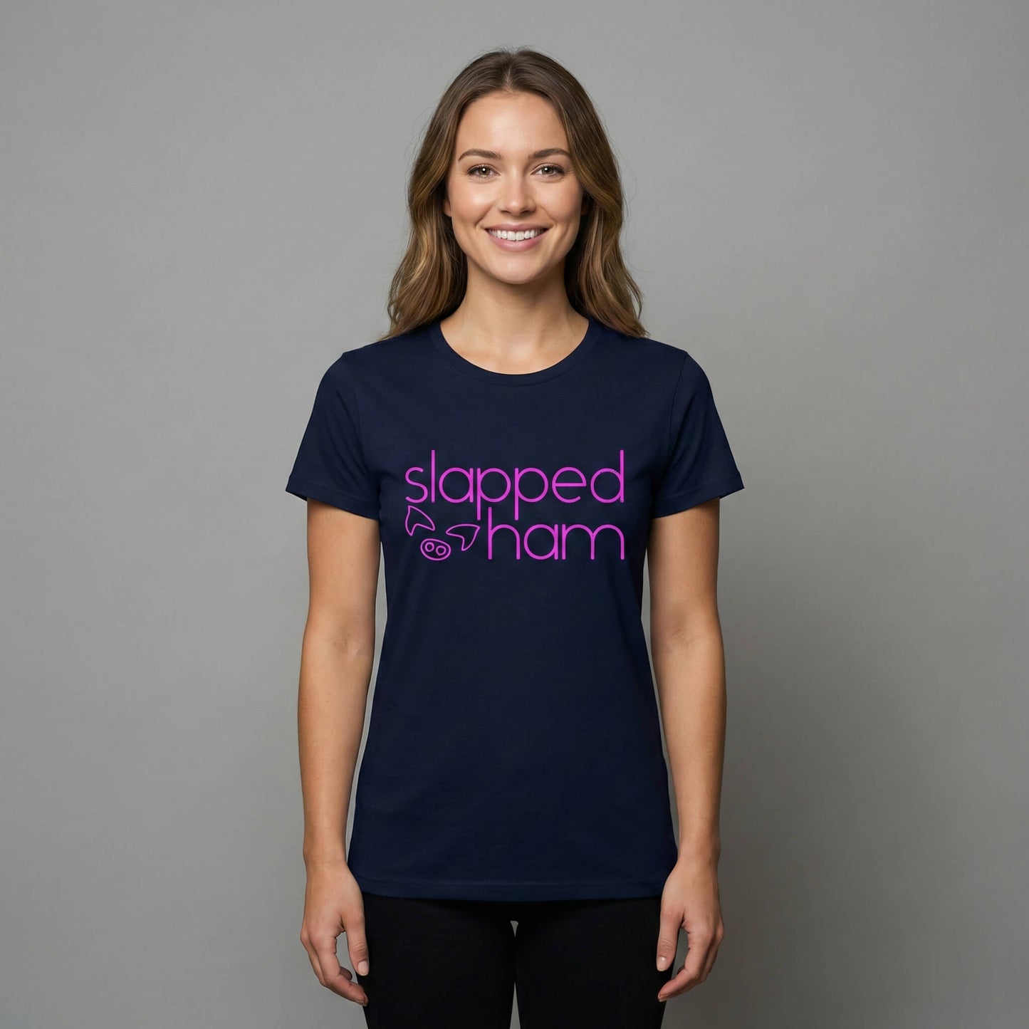 Woman wearing a navy blue t-shirt with 'slapped ham' text on a navy blue background