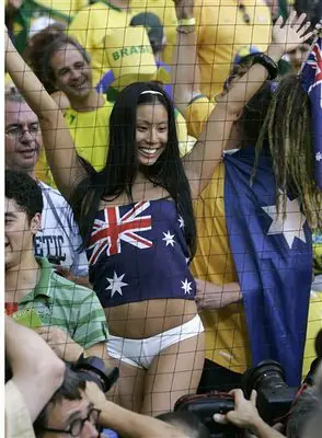 A hot Australian football supporter poses for the camera.