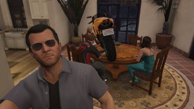 Michael taking a selfie with a motorbike on the table on GTA V.