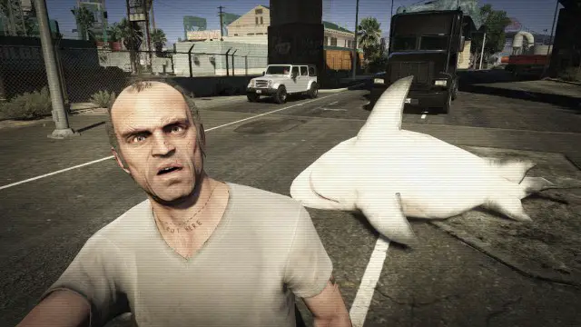 Trevor taking a selfie with a shark in the middle of the road on GTA V.