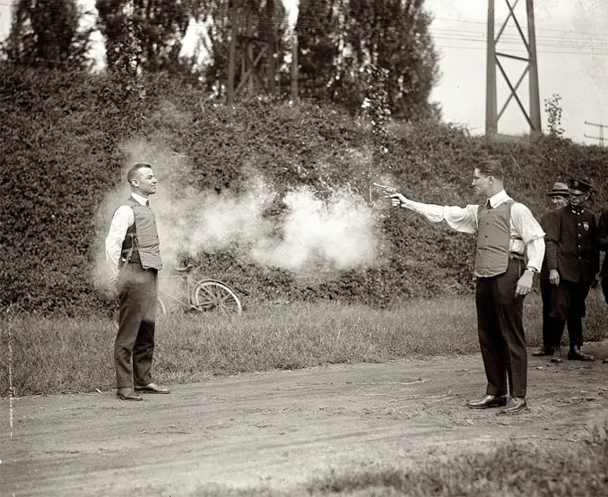 A photo of a man testing a bulletproof vest - 10 Rare Photos From History