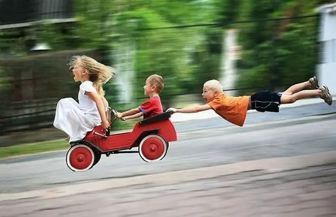 A photo of three children going downhill in a cart - 10 Amazing Photos Taken At Just The Right Time
