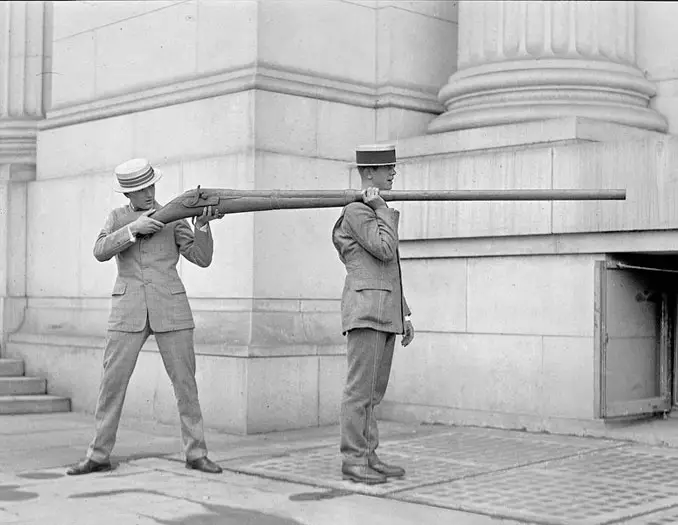A photo of two men with a punt gun - 10 Rare Photos From History