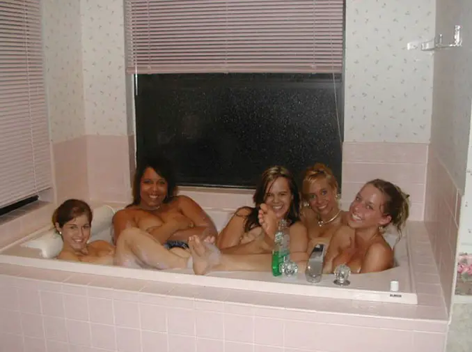 A person photobombing a group of girls in a bathtub - 10 Most Chilling Photobombs Ever Caught On Camera