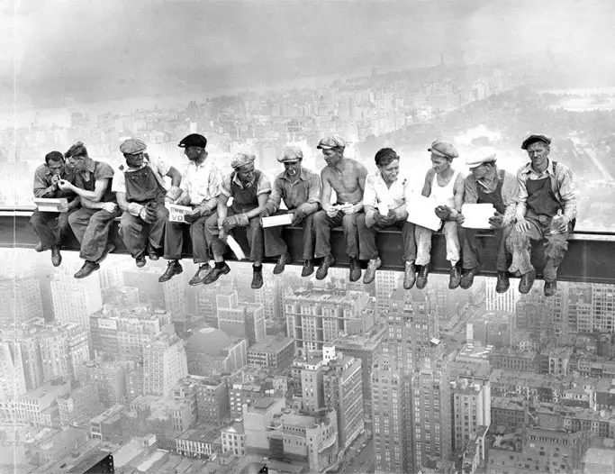 Workers sitting on a tall beam during construction of the Empire State Building - 20 WTF Photos You Just Have To See