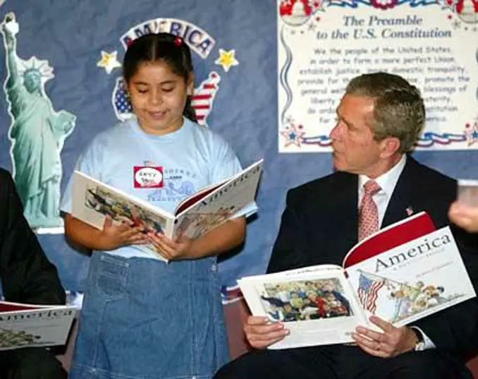 Former President Bush holding the book the right way around. 