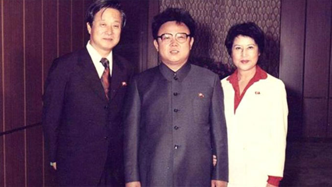 Kim Jong il standing with South Korean film director Shin Sang-ok and former wife, actress Choi Eun-hee - 10 REAL Photos That Are Hiding A Dark Secret