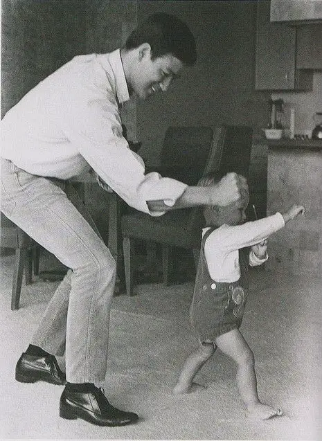 Bruce Lee teaching his son Brandon Lee martial arts.