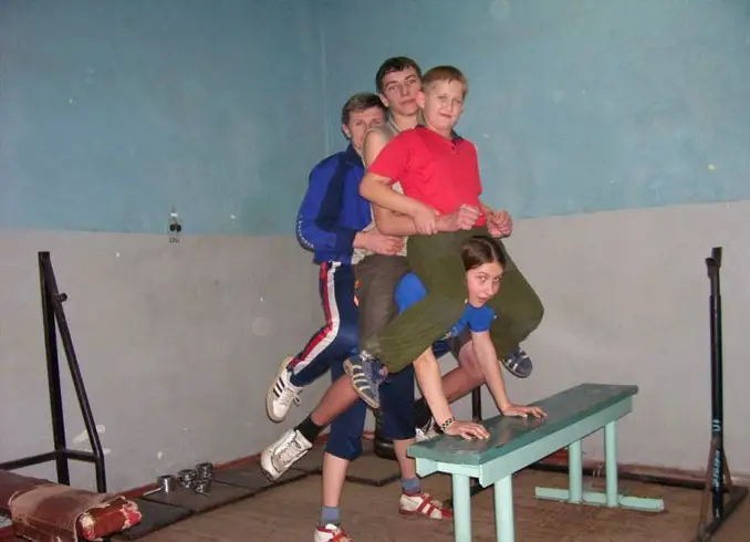 Varvara Akulova holding her family on her back.