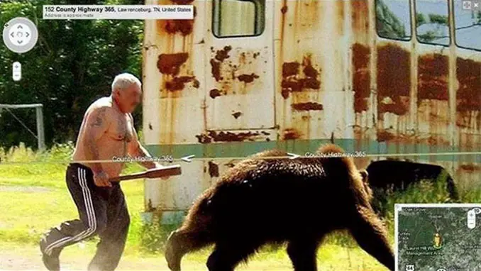 A man chasing a bear with a baseball bat seen on Google Street View.