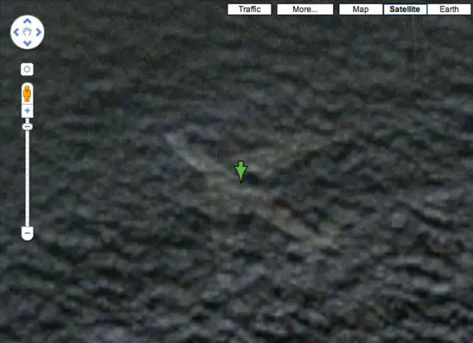 A close up of a plane at the bottom of the ocean seen on Google Earth.