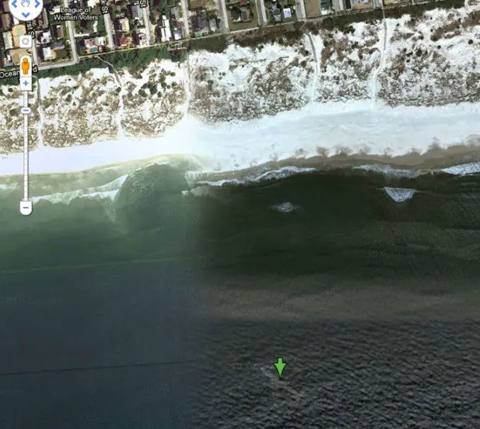 A plane at the bottom of the ocean seen on Google Earth.