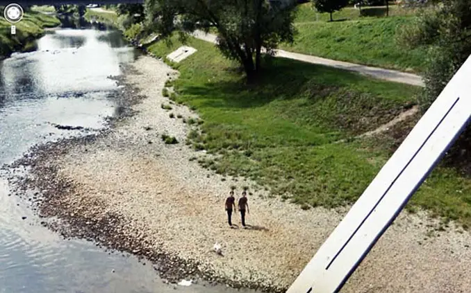 Twin boys walking next to a river seen on Google Maps.