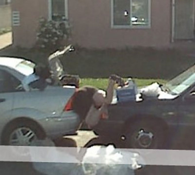 A lady stuck between two cars seen on Google maps.