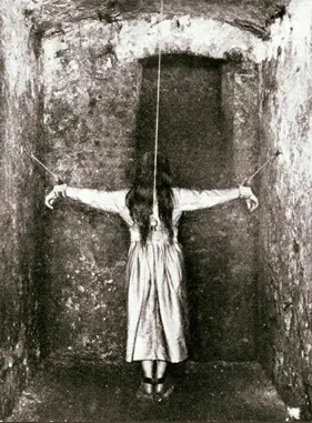 This is one of many real, creepy photos, this one depicts the act of forced standing. A so-called treatment in 1890