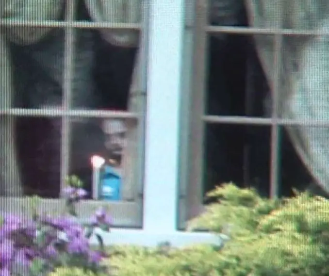 Ghost child looking out of a window in Ravenna, Ohio - 10 Photos of Ghost Children That Have Everyone Scared