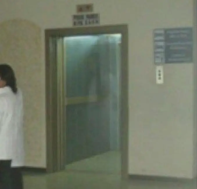 Close up of a doctor's photograph of a ghost in the elevator of a Bolivian hospital - These Hospital Ghost Sightings Have Patients and Staff Worried