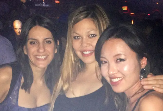 Creepy man photobombing three women - These Creepy Photos Cannot be Explained