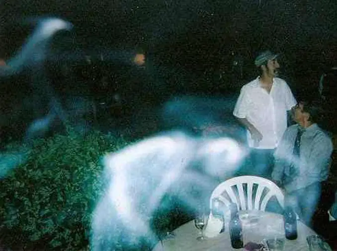 Misty ghost photographed at a wedding - These Creepy Photos Cannot be Explained