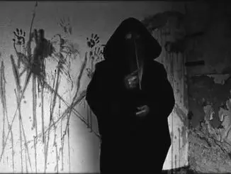 A still from the video 11B-X-1371 or Plague Doctor. An unsolved internet mystery