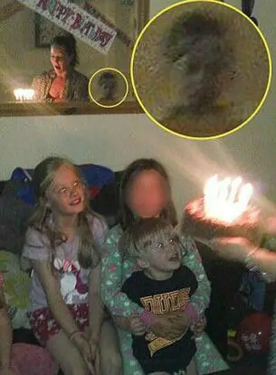 This unsettling photo shows a ghost boy in mirror.