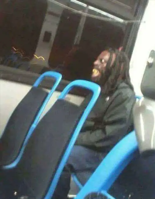 Scary man on a bus.