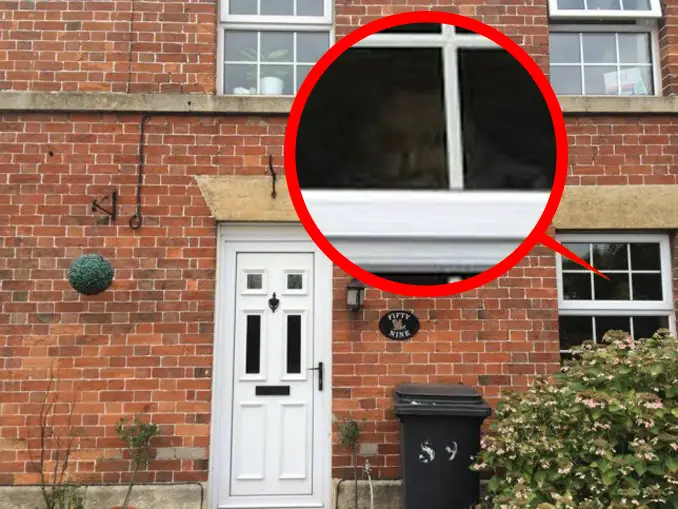 Photo of a ghost in a window.