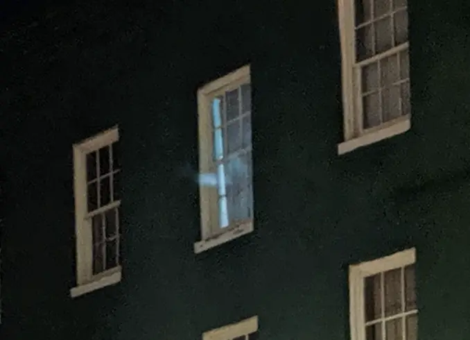 Close up of the ghost in the bar window.