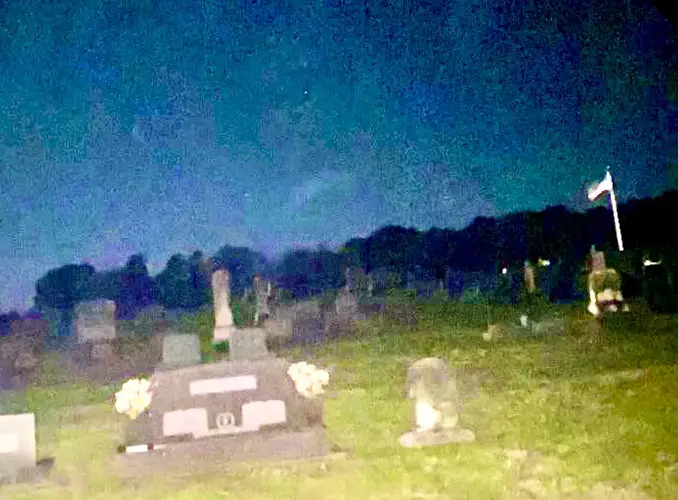 Creepy figure in the cemetery. (Enhanced)