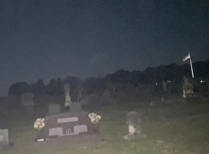 Creepy figure in the cemetery.