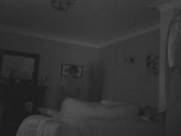 One of a few scary images that shows a possible intruder caught on security camera in a person's home.